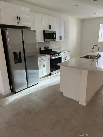 a close view of a sink a counter space and a bathroom