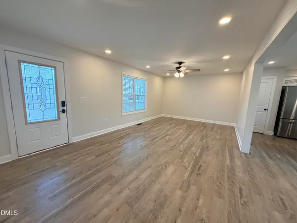 a view of an empty room with a window