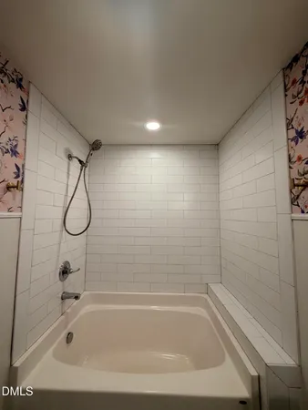 a close view of a bathtub in bathroom