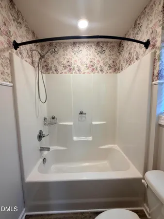 a bathroom with a white bath tub