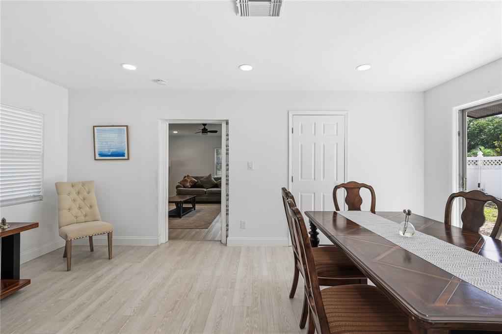 1946 Strathaven Road Winter Park, FL 32792 - Photo 24 of 37 a view of a dining room with furniture and wooden floor