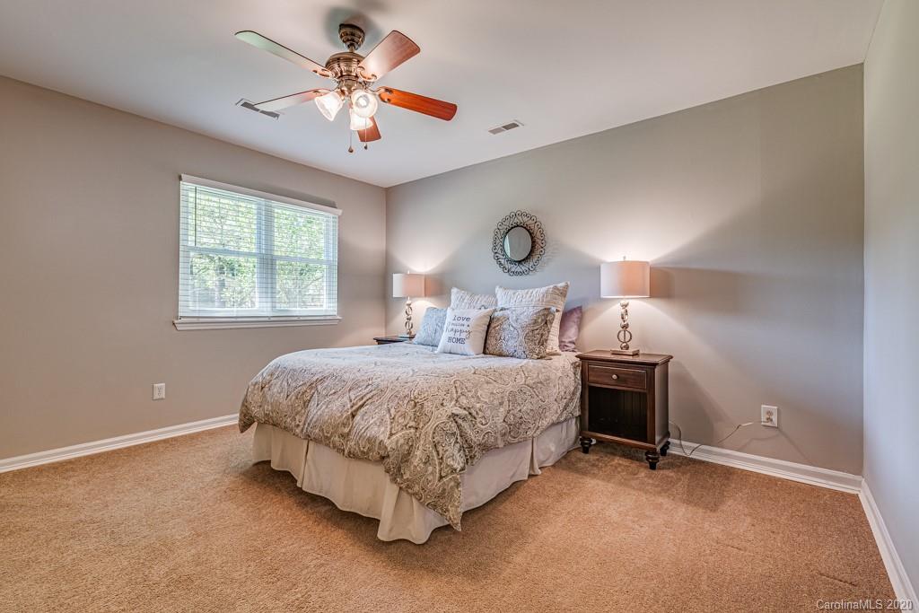 10125 Fairway Ridge Road Charlotte, NC 28277 - Photo 12 of 25 a bedroom with a bed and a large window