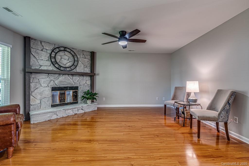 10125 Fairway Ridge Road Charlotte, NC 28277 - Photo 4 of 25 a living room with furniture a fireplace and a fireplace