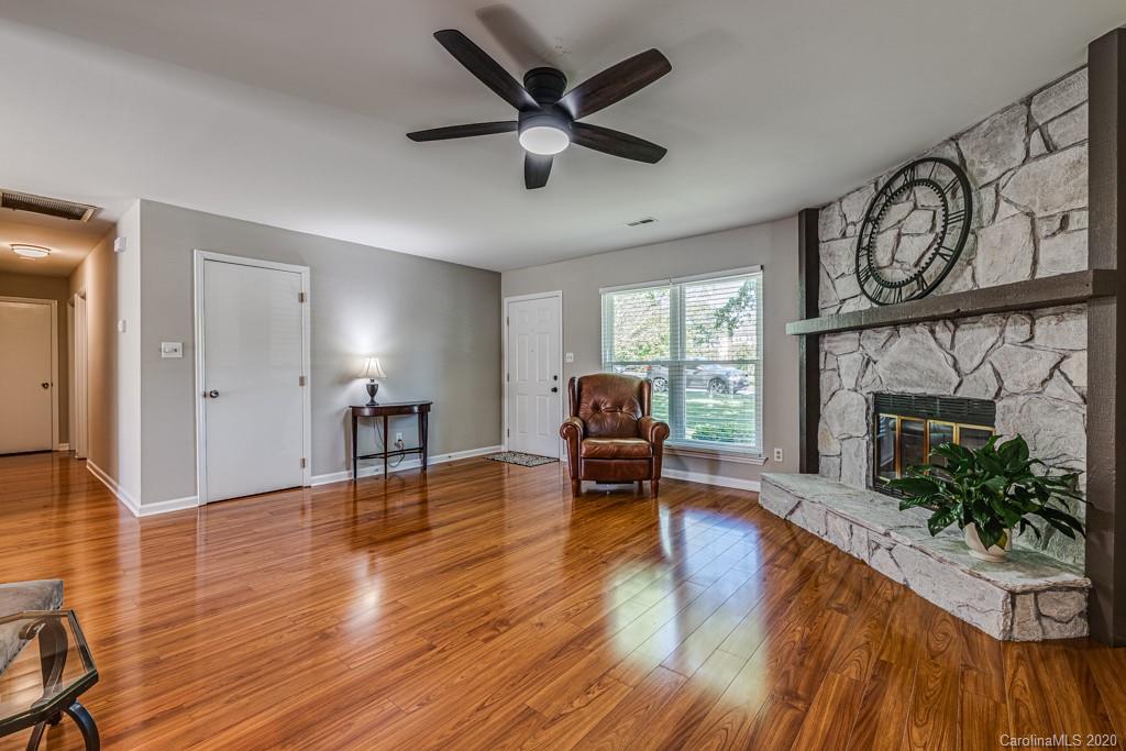 10125 Fairway Ridge Road Charlotte, NC 28277 - Photo 6 of 25 a living room with furniture and a fireplace