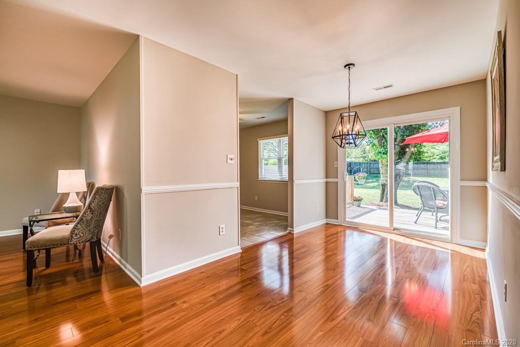 10125 Fairway Ridge Road Charlotte, NC 28277 - Photo 8 of 25 a view of a hallway with wooden floor and windows