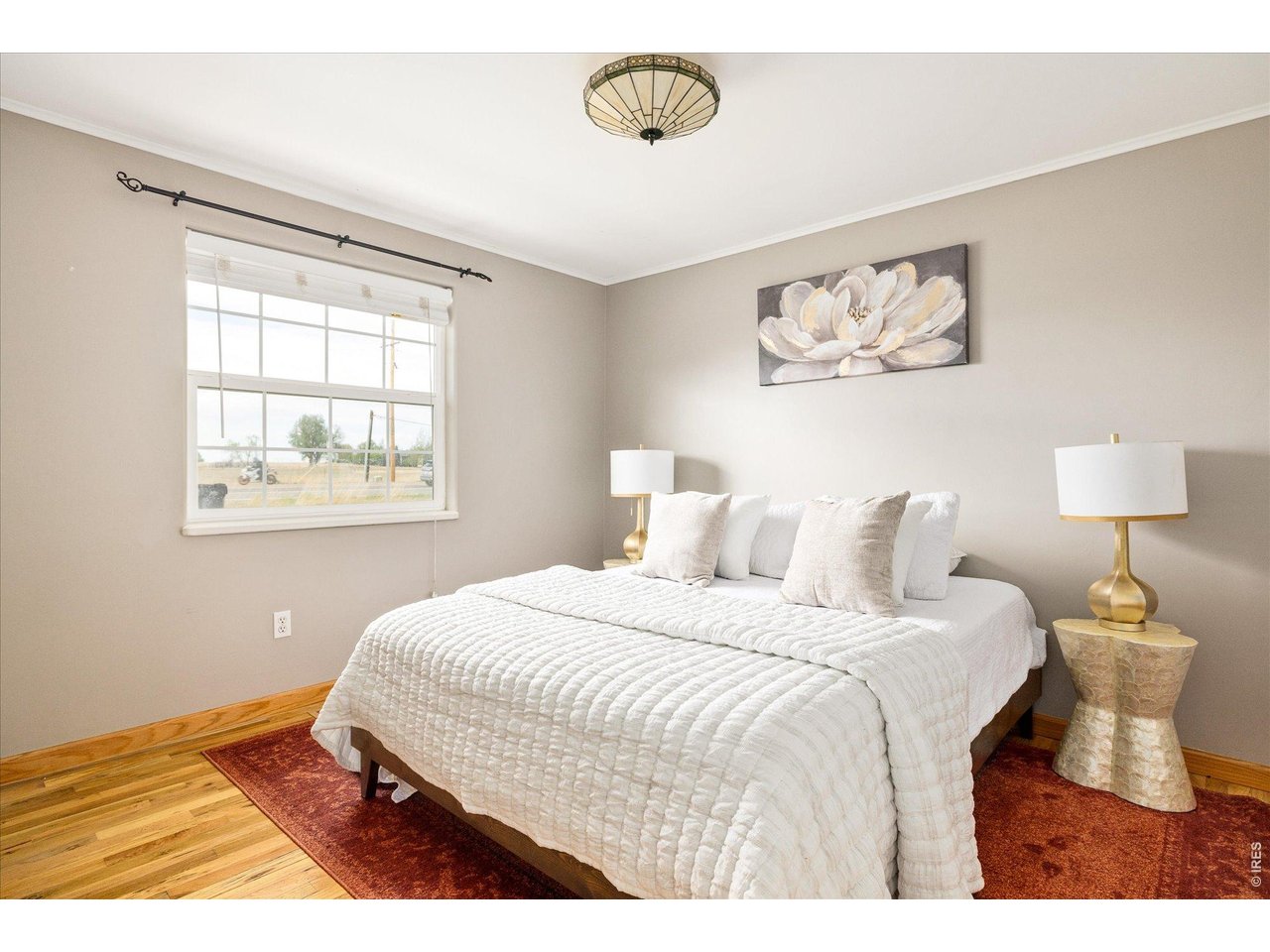 9234 Arapahoe Road Boulder, CO 80303 - Photo 18 of 37 well-sized secondary bedroom with large window, warm finishes and flexible use