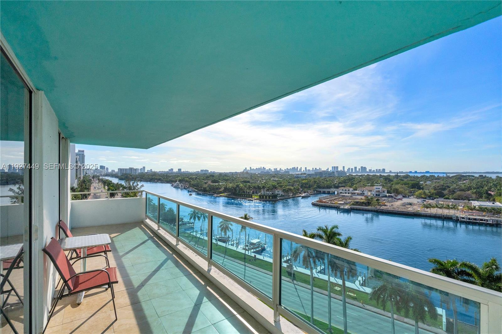 5101 Collins Avenue, Unit 12R Miami Beach, FL 33140 - Photo 10 of 13 a view of city and a lake from a balcony