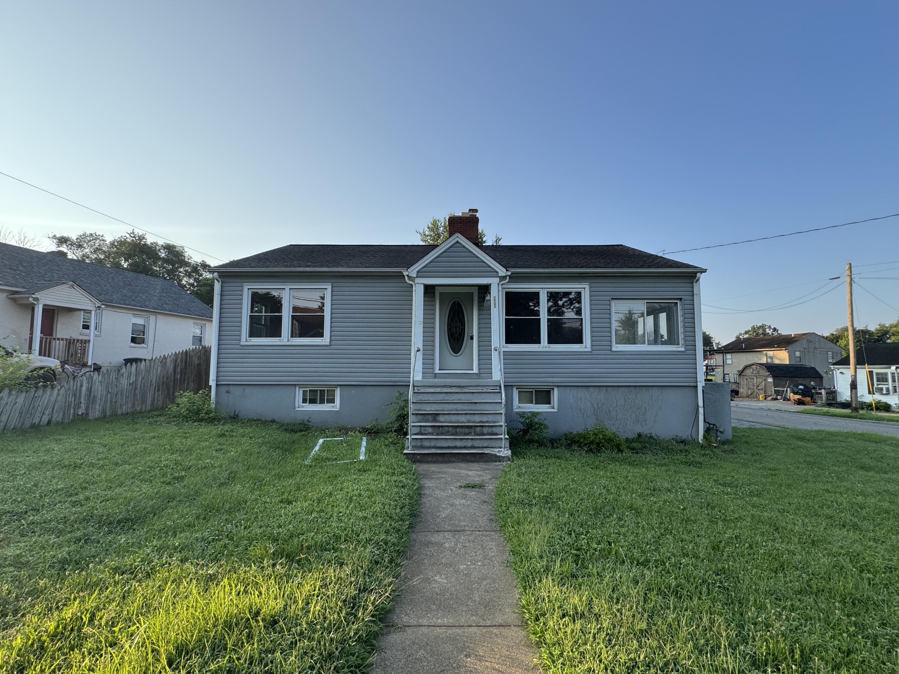 403 Liberty Road Northeast Roanoke, VA 24012 - Photo 1 of 20 a front view of a house with garden