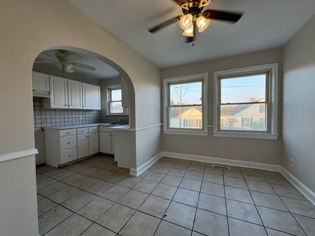 a kitchen with a sink a window and stainless steel appliances