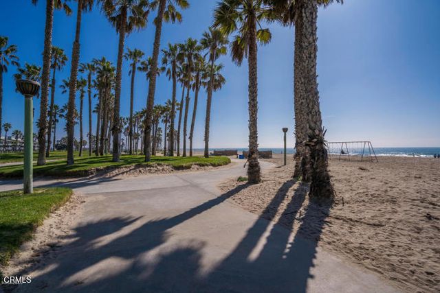 a room with a wooden floor and cabinets