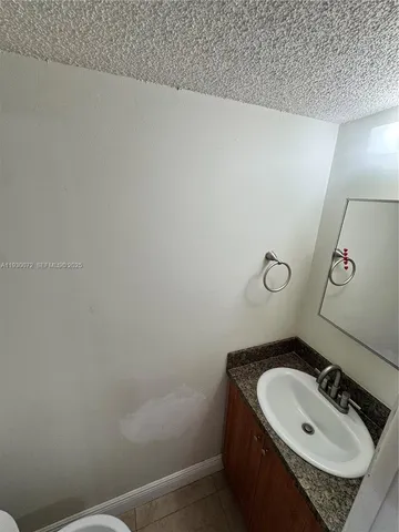 a bathroom with a sink and vanity
