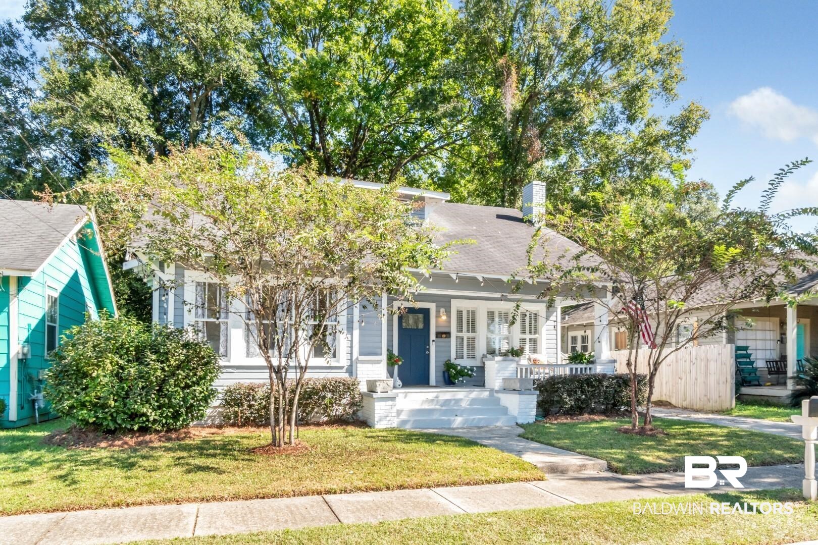 116 Item Avenue Mobile, AL 36607 - Photo 32 of 33 View of front facade with covered porch and a front lawn