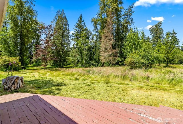 a view of swimming pool with a yard