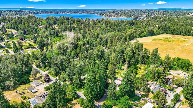 a view of a yard with an outdoor seating