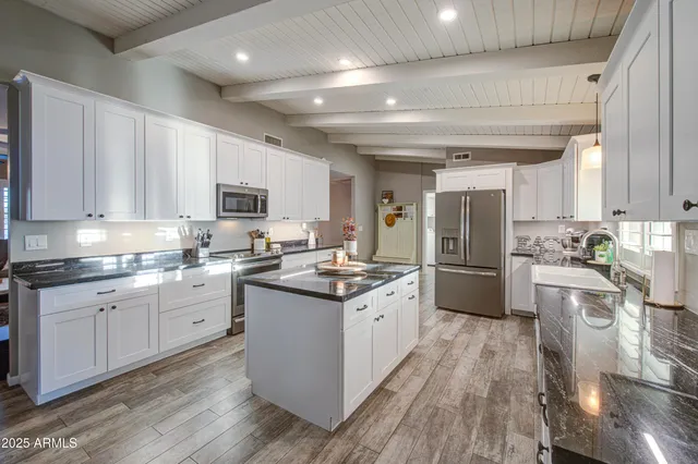 a picture of a bathroom with a refrigerator