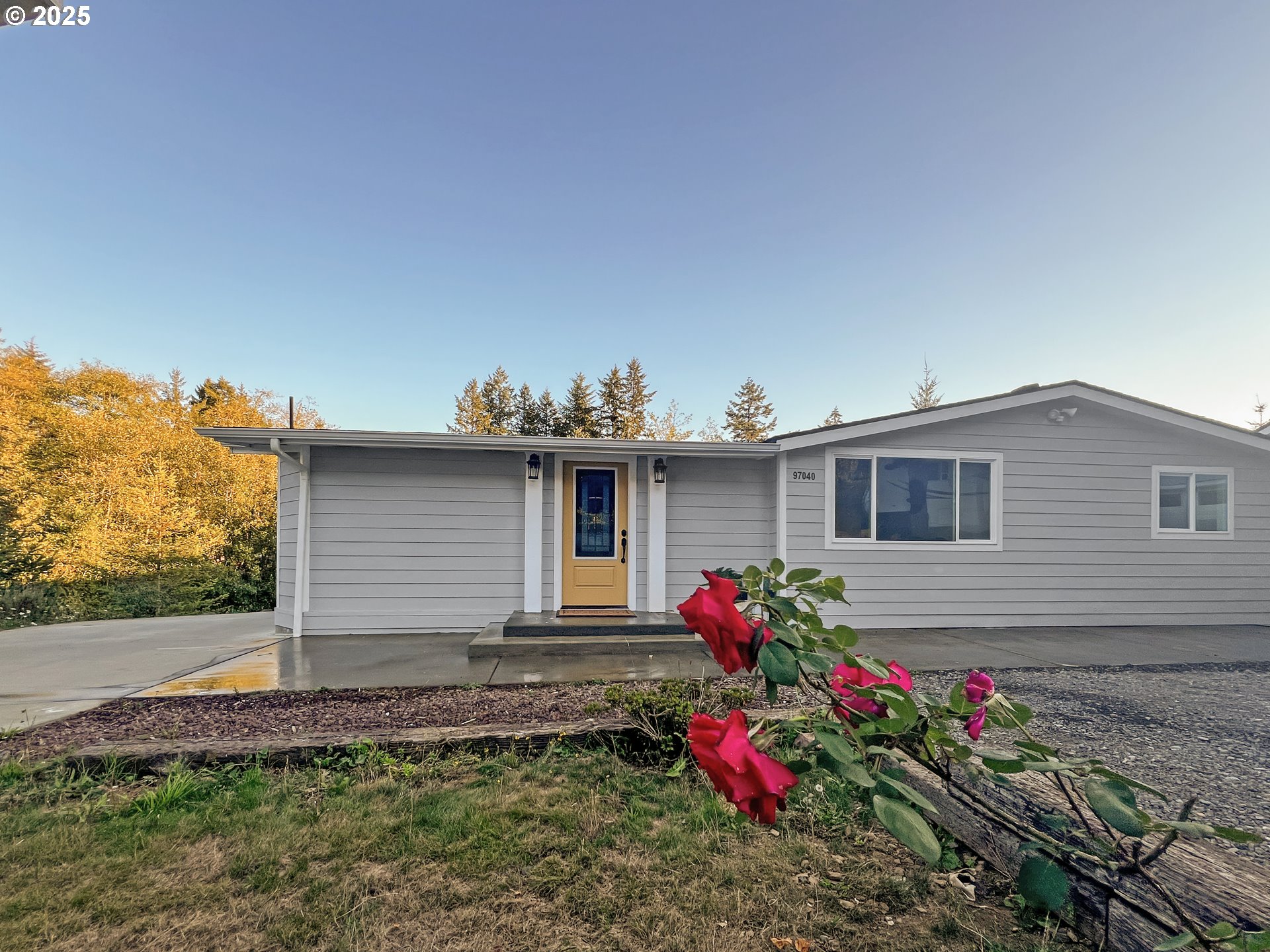 97040 Henderson Road Brookings, OR 97415 - Photo 2 of 36 a front view of a house with a yard