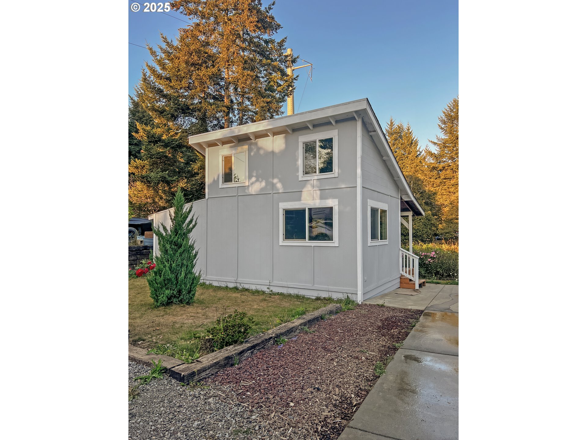 97040 Henderson Road Brookings, OR 97415 - Photo 4 of 36 a view of a house with a yard