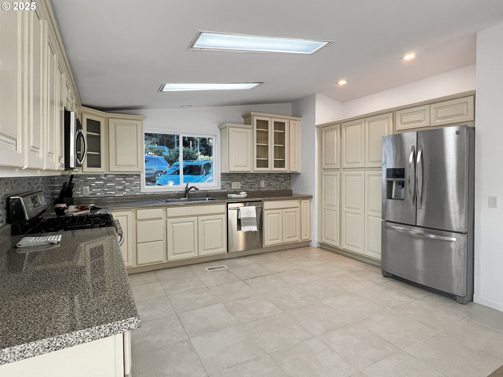 97040 Henderson Road Brookings, OR 97415 - Photo 6 of 36 a kitchen with a sink appliances and cabinets