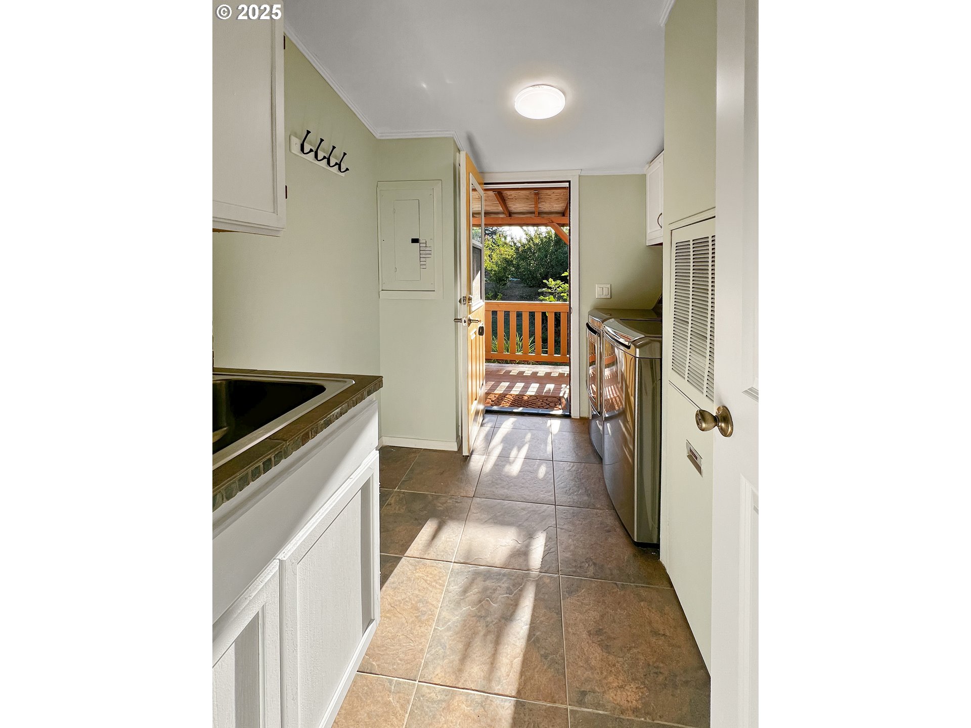 97040 Henderson Road Brookings, OR 97415 - Photo 7 of 36 a hallway with sliding door and yard