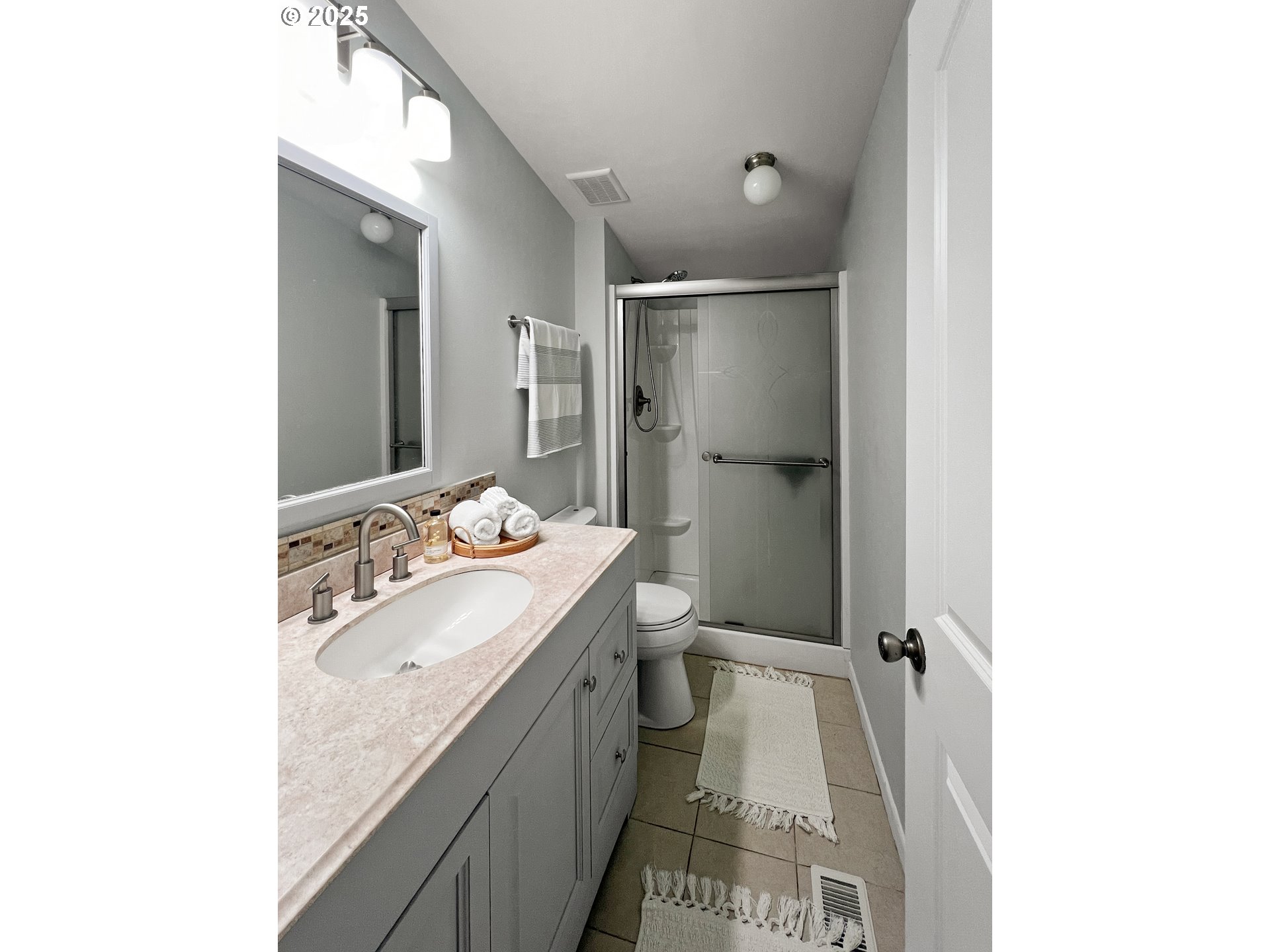 97040 Henderson Road Brookings, OR 97415 - Photo 8 of 36 a bathroom with a sink and a mirror