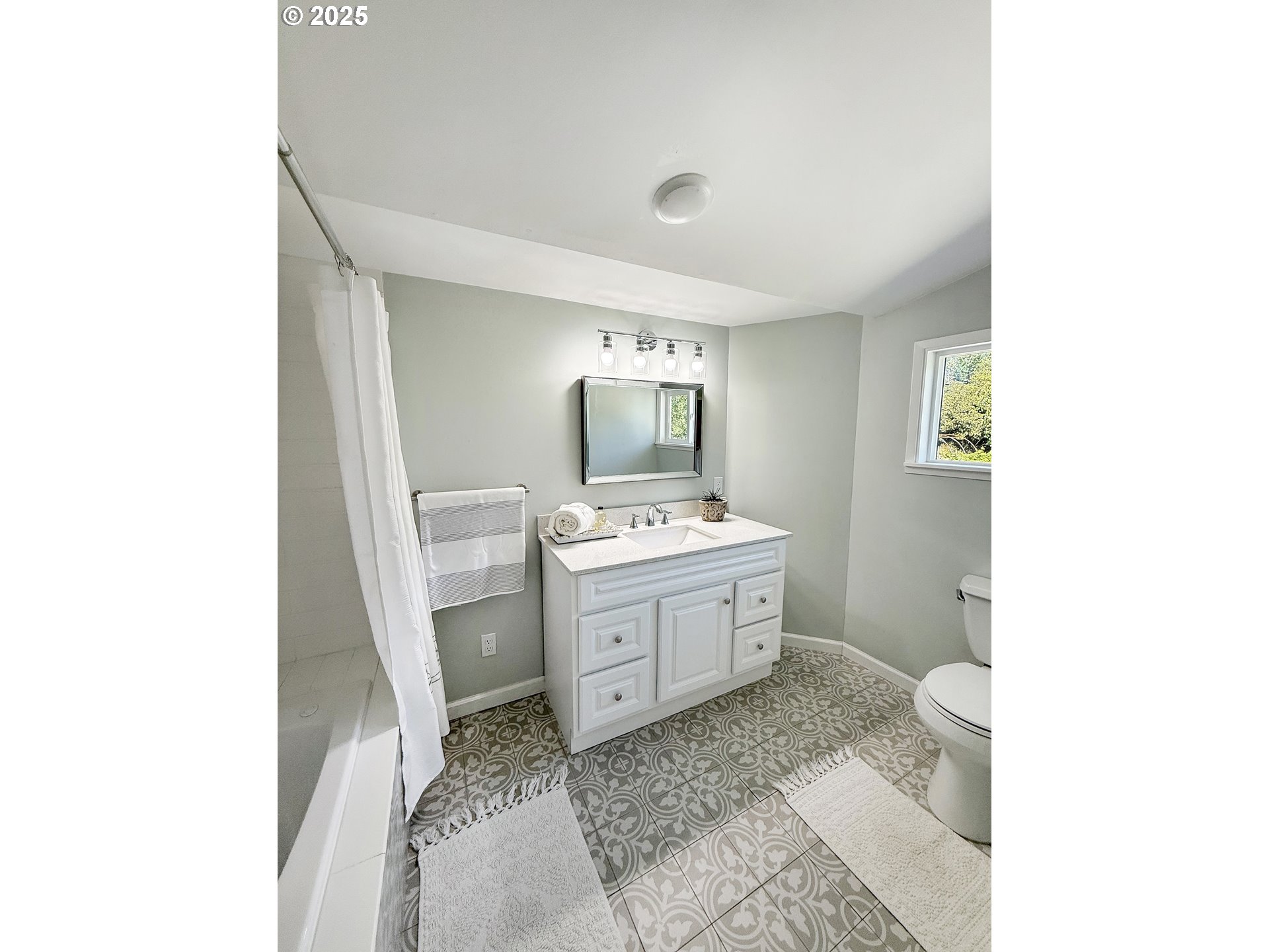 97040 Henderson Road Brookings, OR 97415 - Photo 9 of 36 a bathroom with a sink a toilet and a mirror