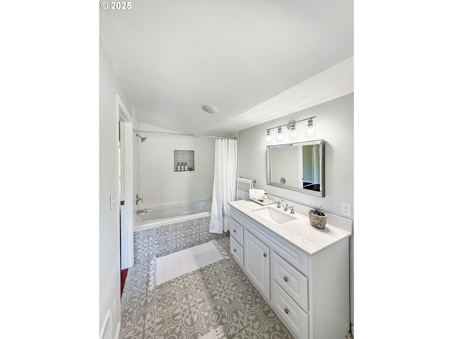 97040 Henderson Road Brookings, OR 97415 - Photo 10 of 36 a bathroom with a sink a mirror and a bathtub