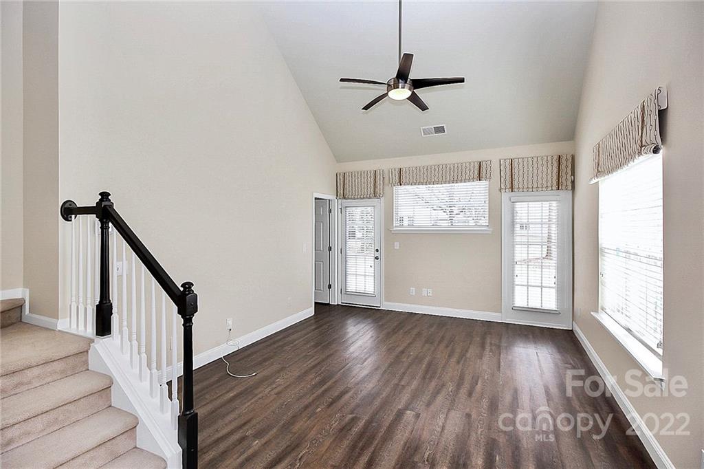 11630 Rabbit Ridge Road Charlotte, NC 28270 - Photo 11 of 32 a view of empty room with wooden floor and fan