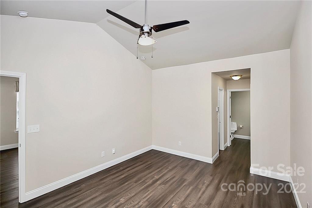 11630 Rabbit Ridge Road Charlotte, NC 28270 - Photo 16 of 32 a view of an empty room with wooden floor