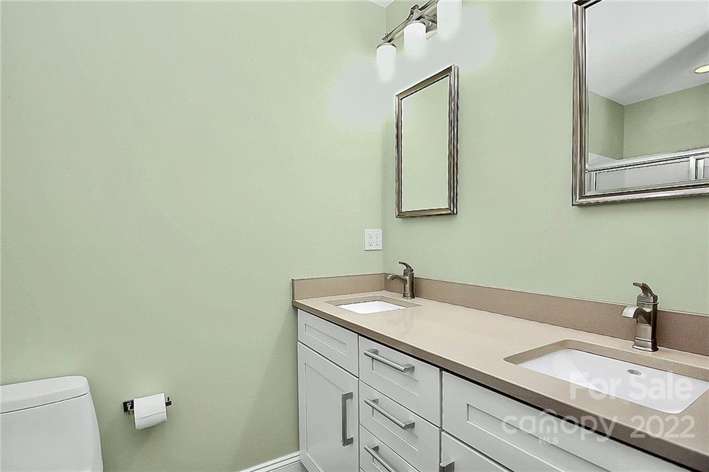 11630 Rabbit Ridge Road Charlotte, NC 28270 - Photo 20 of 32 a bathroom with a granite countertop sink and a toilet