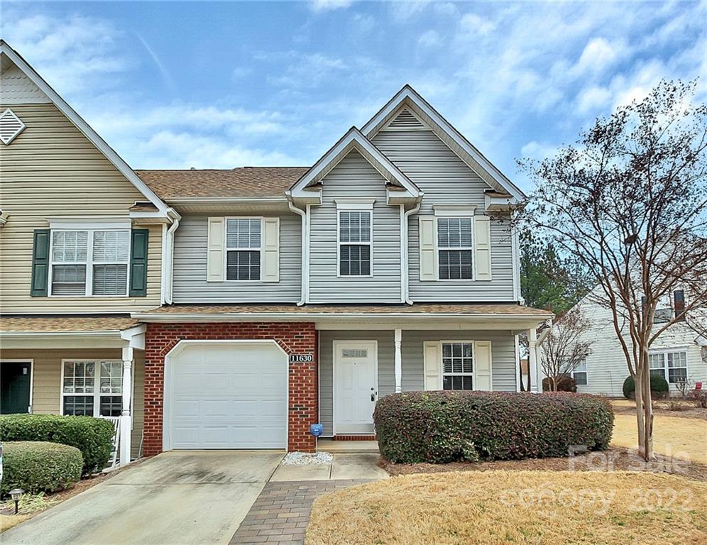 11630 Rabbit Ridge Road Charlotte, NC 28270 - Photo 2 of 32 a front view of a house with a garden
