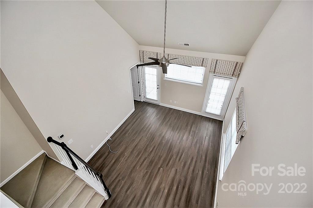11630 Rabbit Ridge Road Charlotte, NC 28270 - Photo 22 of 32 a view of a hallway with wooden floor