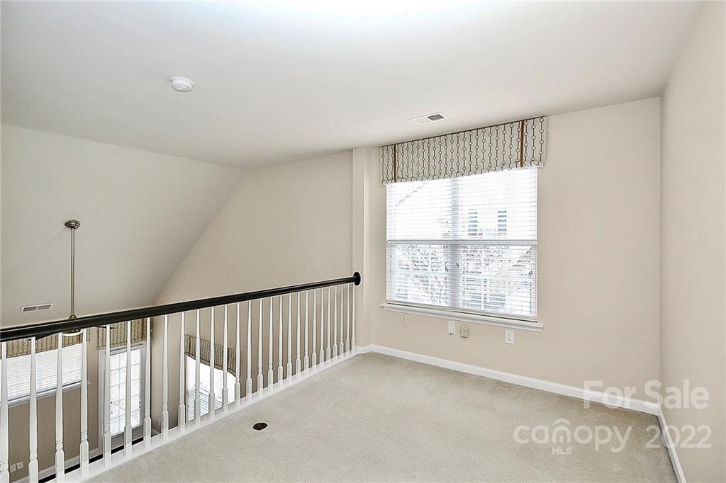 11630 Rabbit Ridge Road Charlotte, NC 28270 - Photo 23 of 32 a view of an empty room with a window