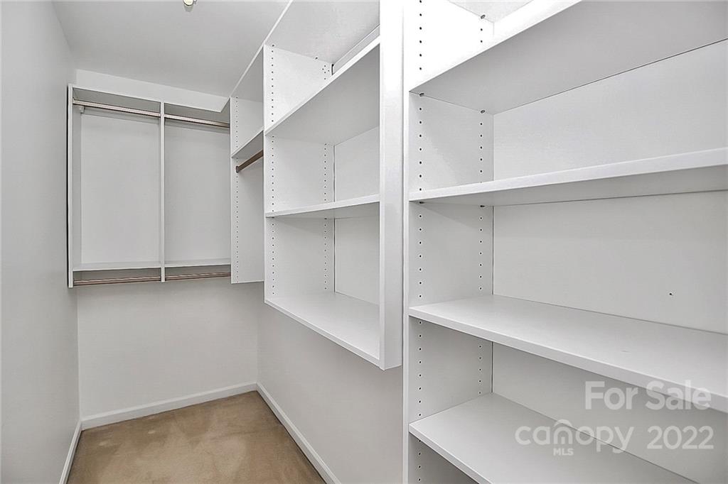 11630 Rabbit Ridge Road Charlotte, NC 28270 - Photo 28 of 32 a view of walk in closet with empty racks