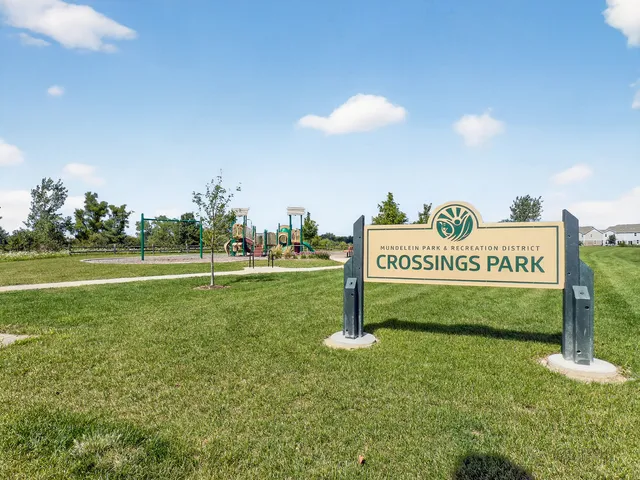 a sign board with grassy area