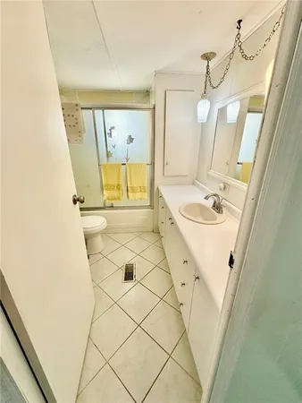 a bathroom with a sink a mirror and a shower