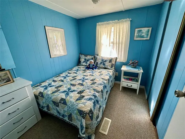 a bedroom with a bed and a closet