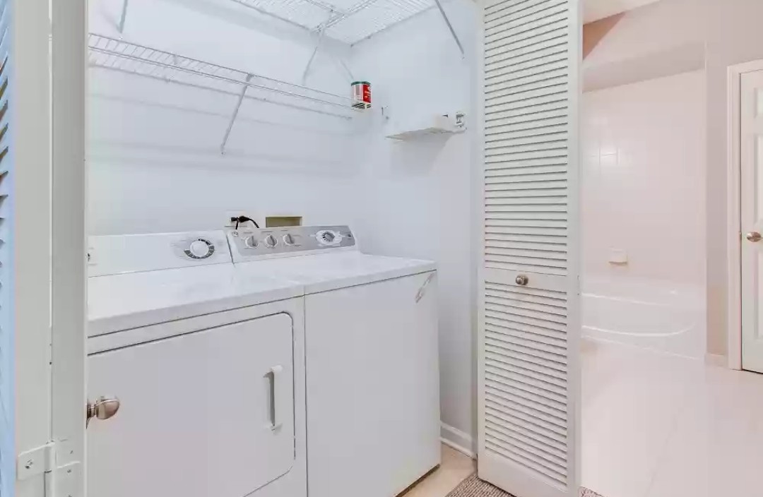 133 West Palatine Road, Unit 102 Palatine, IL 60067 - Photo 16 of 21 a utility room with dryer and washer