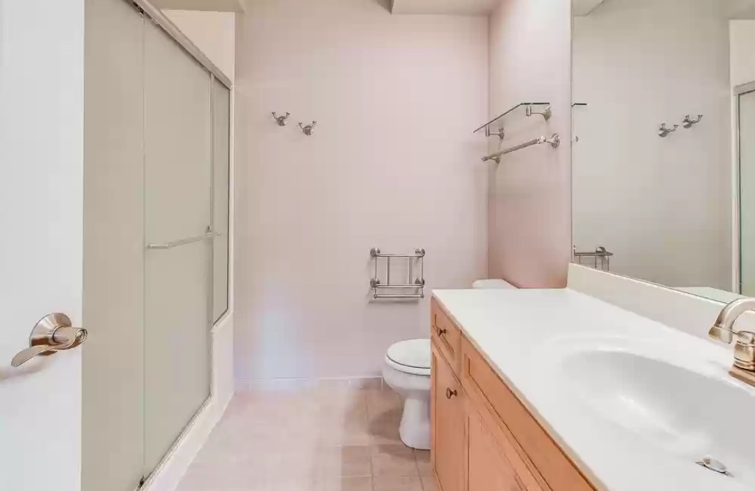 133 West Palatine Road, Unit 102 Palatine, IL 60067 - Photo 17 of 21 a bathroom with a sink toilet and shower