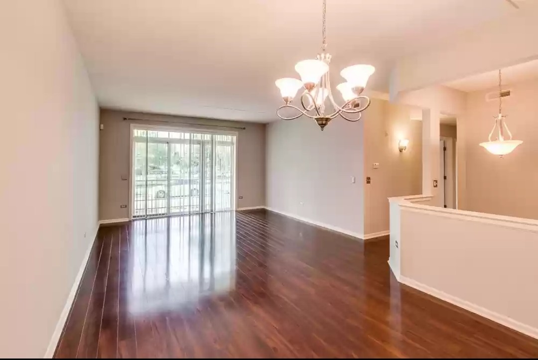 133 West Palatine Road, Unit 102 Palatine, IL 60067 - Photo 3 of 21 a view of a room with wooden floor