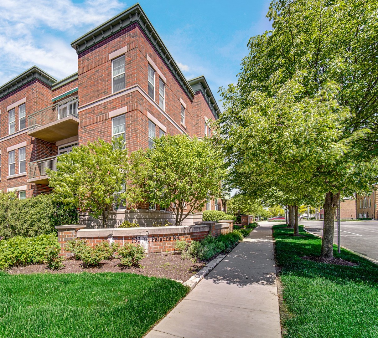133 West Palatine Road, Unit 102 Palatine, IL 60067 - Photo 9 of 21 a front view of a house with a yard