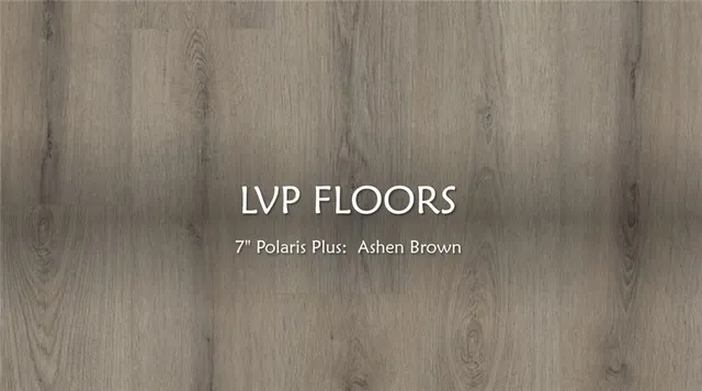 a front view of a house with a yard table and chairs