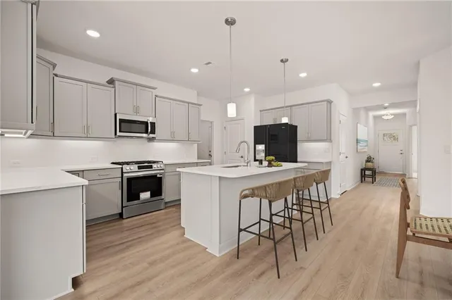 a view of a dining room with furniture and wooden floor