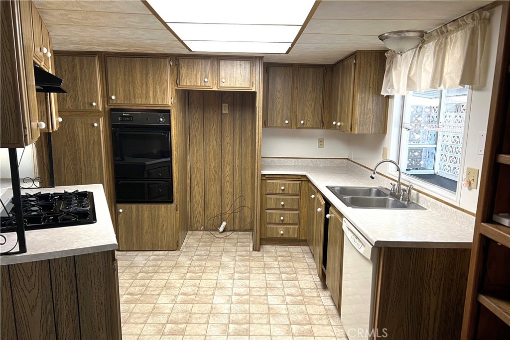 217 Hope Way Nipomo, CA 93444 - Photo 10 of 15 a kitchen with a sink a stove and refrigerator