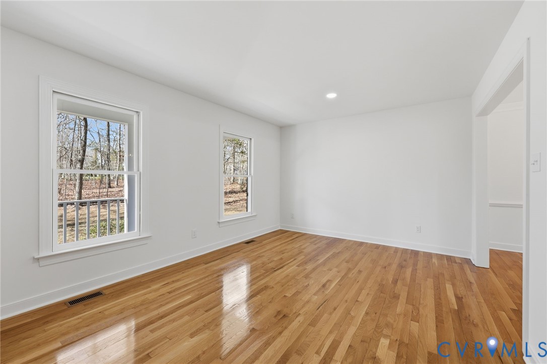 3264 Sherwood Ridge Way Powhatan, VA 23139 - Photo 6 of 40 a view of empty room with wooden floor and fan
