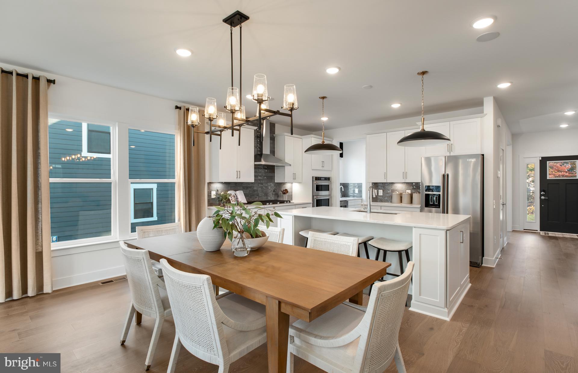 18260 Hobbes Rst Lane Leesburg, VA 20176 - Photo 18 of 63 a dining room filled chandelier and wooden floor