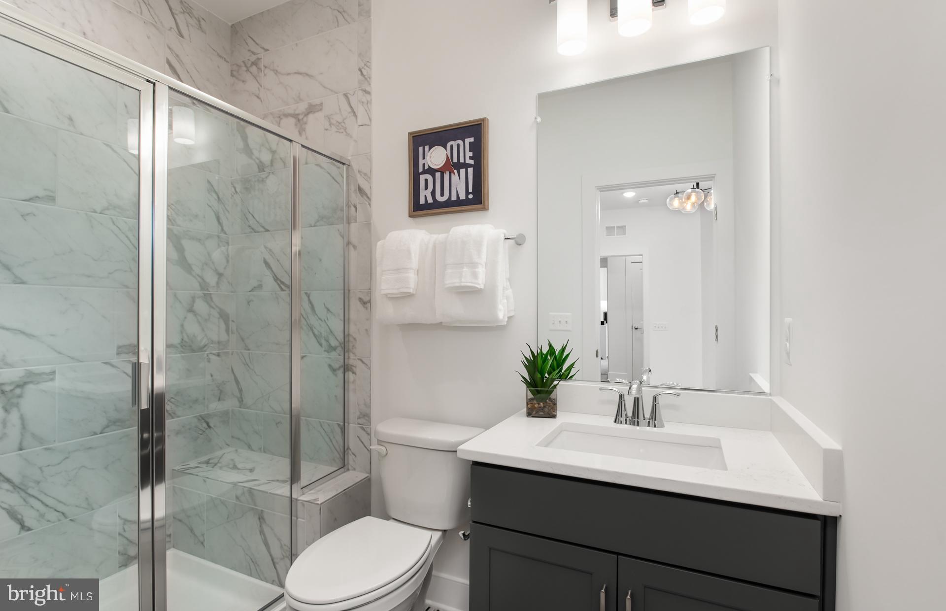 18260 Hobbes Rst Lane Leesburg, VA 20176 - Photo 32 of 63 a bathroom with a sink toilet a mirror and shower