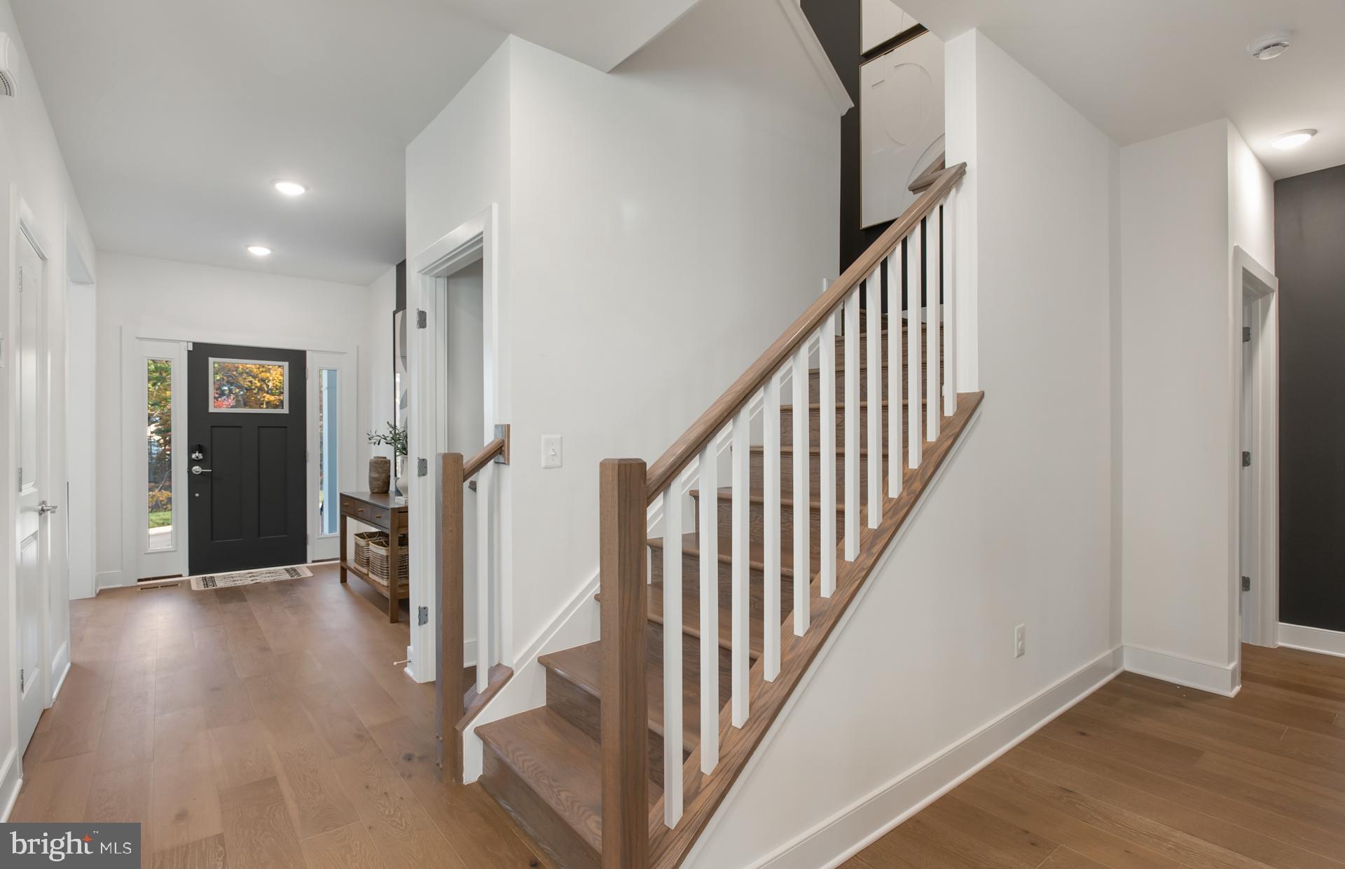 18260 Hobbes Rst Lane Leesburg, VA 20176 - Photo 5 of 63 a view of an entryway with wooden floor and stairs