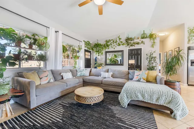 a living room with furniture and a large window