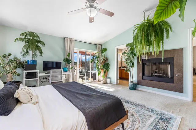 a bedroom with a bed and a fireplace