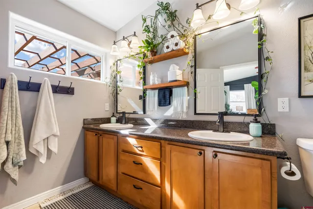 a bathroom with a sink a vanity and a mirror